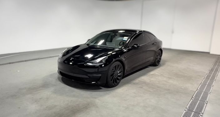 2022 Tesla Model 3 Performance in Solid Black — photo 1