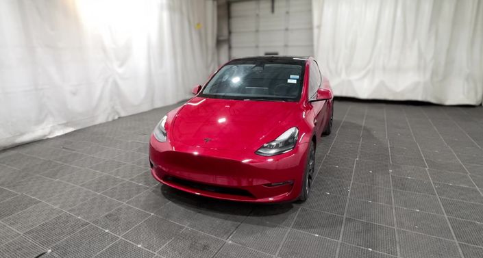 2023 Tesla Model Y Performance All-Wheel Drive in Red — photo 1