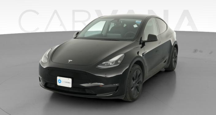 2025 Tesla Model Y Long Range All-Wheel Drive in Solid Black — photo 1