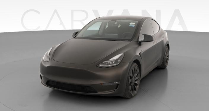 2023 Tesla Model Y Performance All-Wheel Drive in Solid Black — photo 1