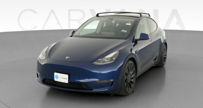 2023 Tesla Model Y Performance All-Wheel Drive in Deep Blue Metallic — photo 1
