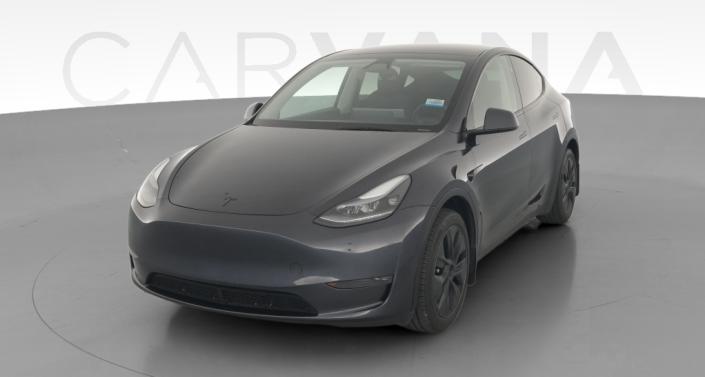 2025 Tesla Model Y Long Range All-Wheel Drive in Stealth Grey — photo 1