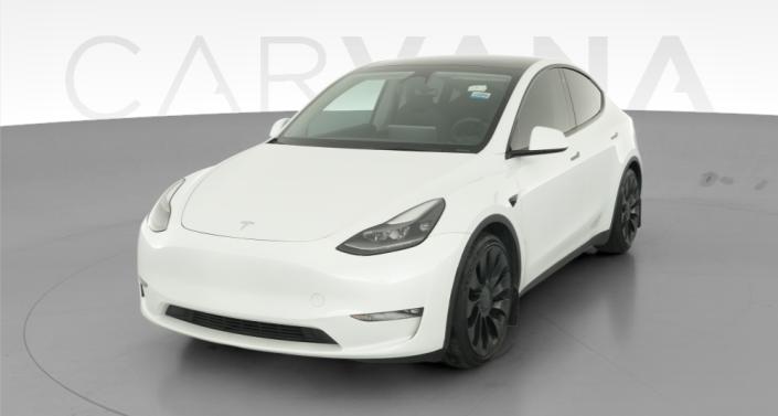 2023 Tesla Model Y Performance All-Wheel Drive in Pearl White — photo 1