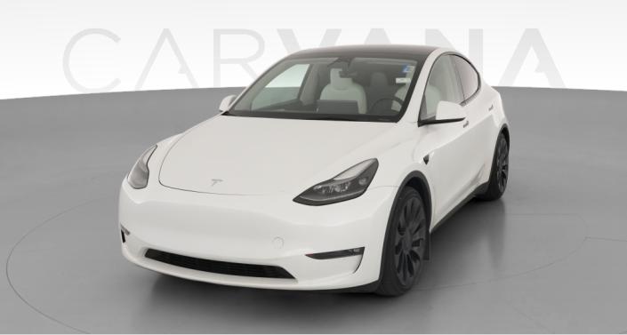 2023 Tesla Model Y Performance All-Wheel Drive in Pearl White — photo 1