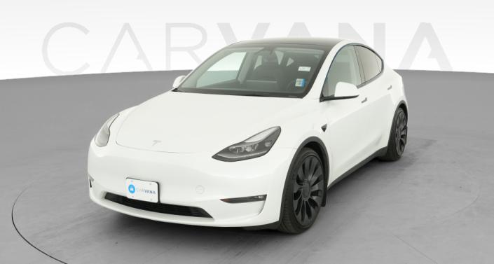 2023 Tesla Model Y Performance All-Wheel Drive in Pearl White — photo 1